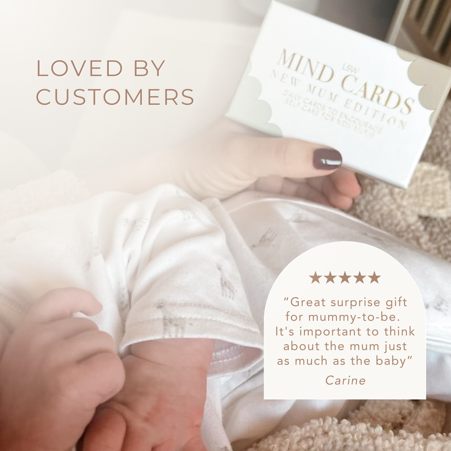 Baby's hand holding a card with text 'Loved by customers' and a five-star review.
