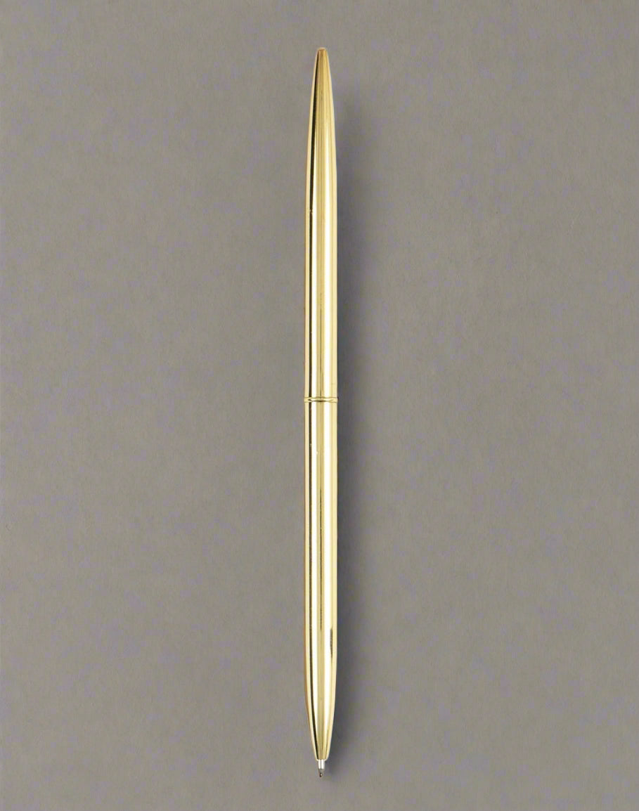 Gold pen on a taupe background