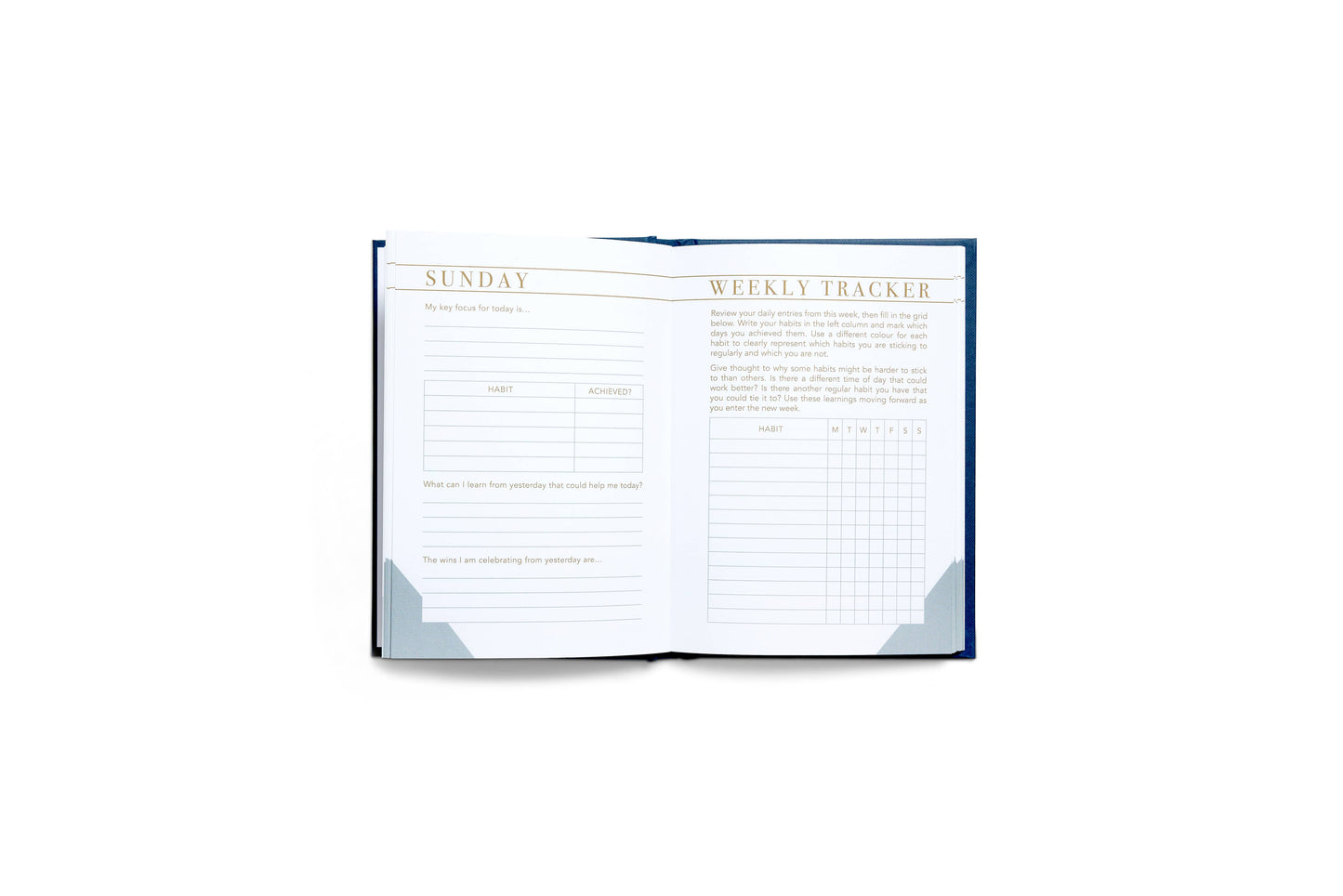 Open weekly tracker notebook on a white background