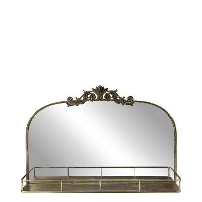 Decorative mirror with gold frame and shelf on a white background