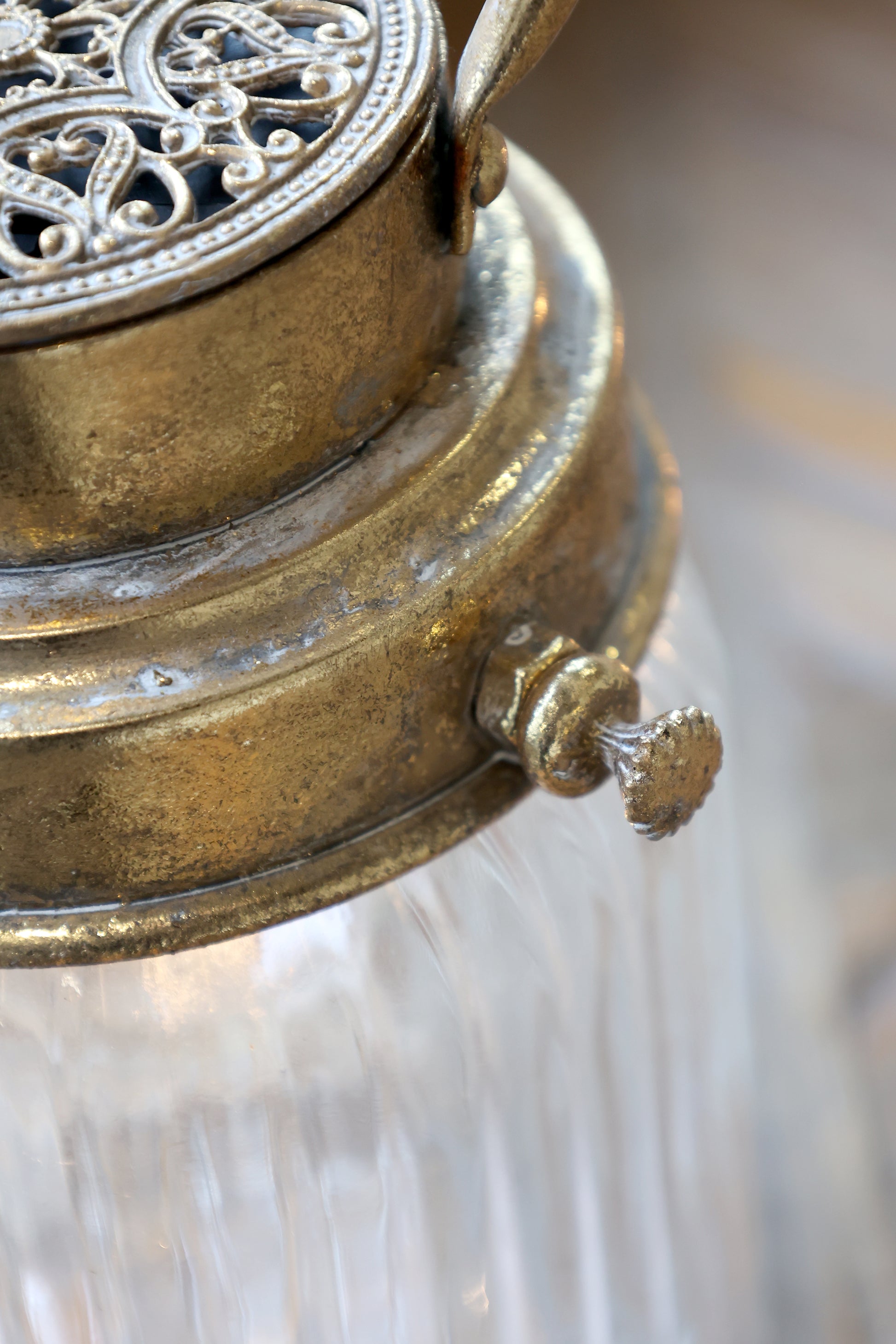 Close-up of a decorative metal lantern with intricate designs.