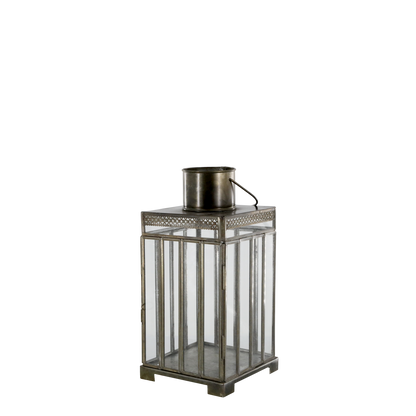 Decorative metal lantern with glass panels on a white background