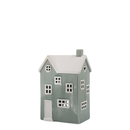 Decorative house-shaped lantern with a white roof on a white background
