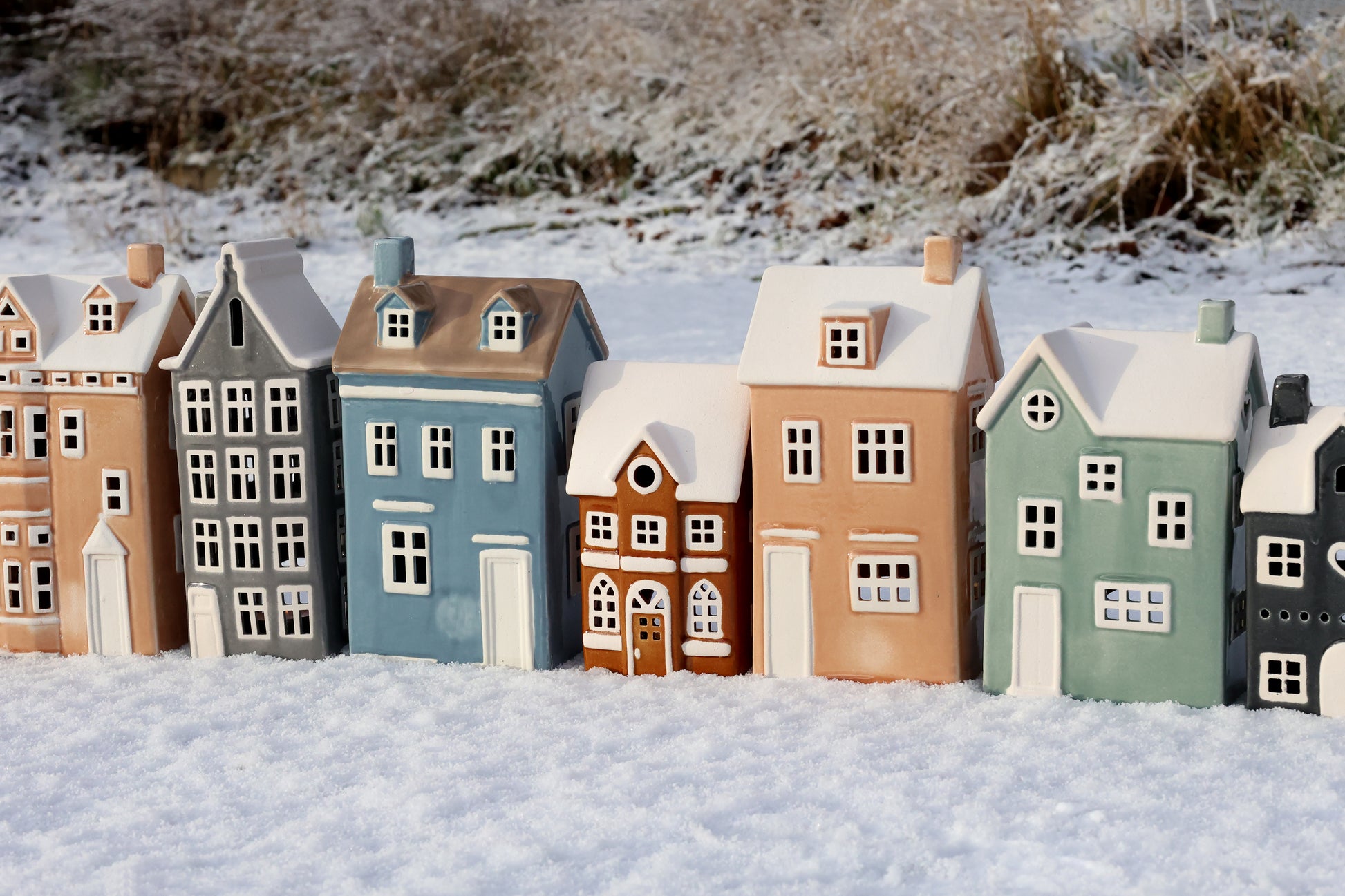 Model houses in various colors on a snowy landscape