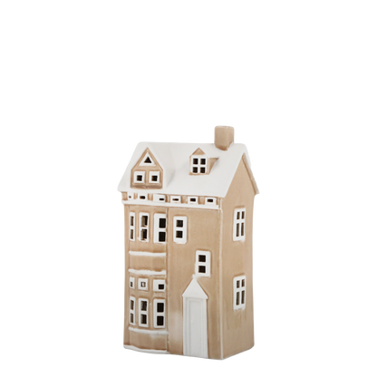 Ceramic house-shaped vase with a beige body and white accents on a white background