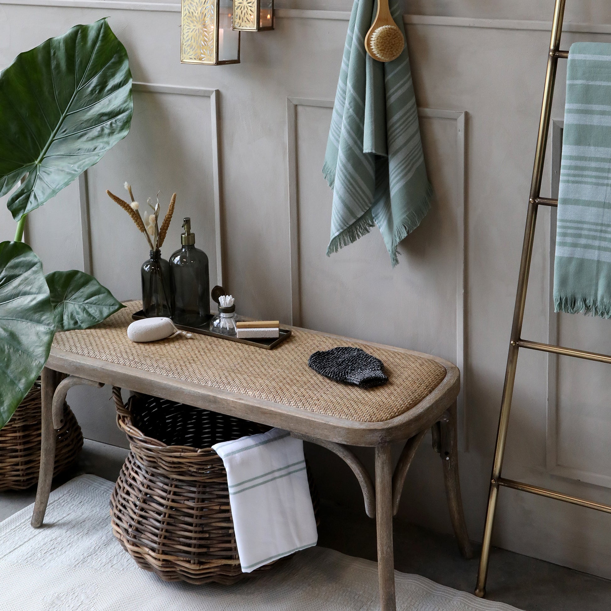 Nautical-themed room with a wooden bench, lanterns, and decorative items.