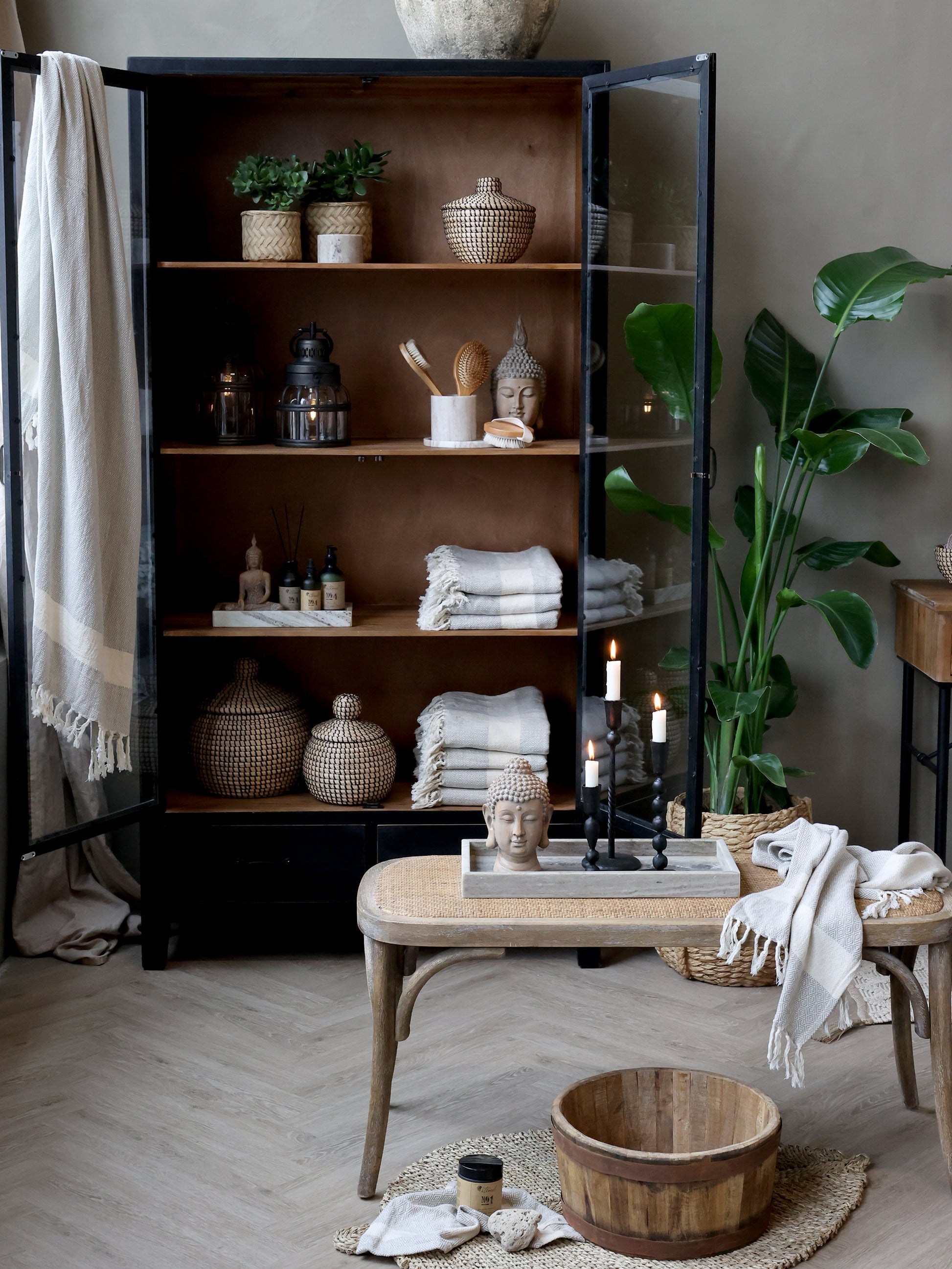 Nest living room with a bookshelf, coffee table, and decorative items.