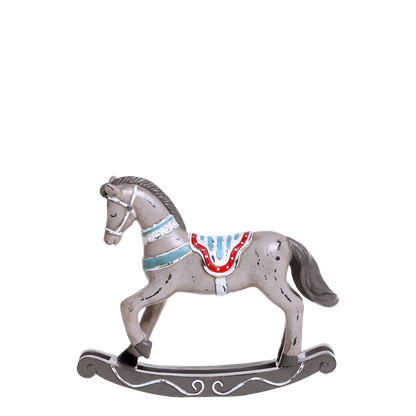 Wooden rocking horse with a decorative saddle on a white background