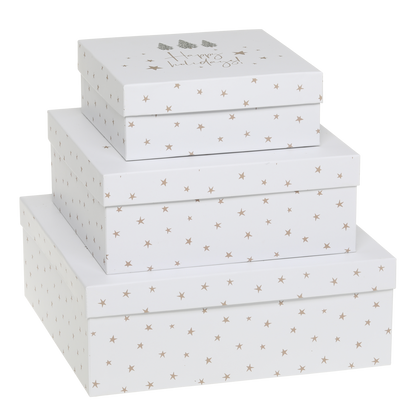 Set of three white storage boxes with star pattern on a white background