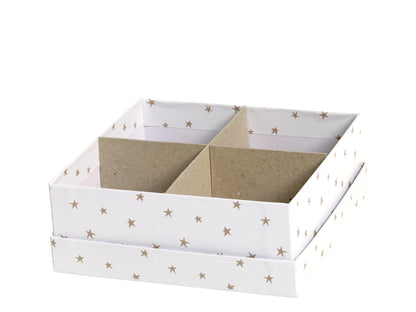 White storage box with star patterns and divided compartments on a white background
