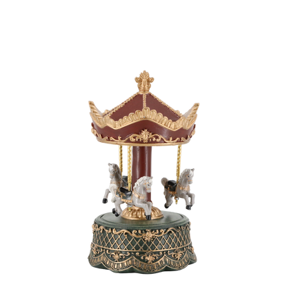 Decorative carousel figurine with horses on a white background