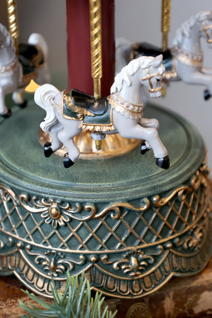 Decorative carousel with horses on a ornate base