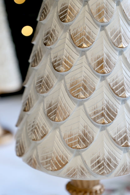 Decorative white and gold textured lamp on a blurred background