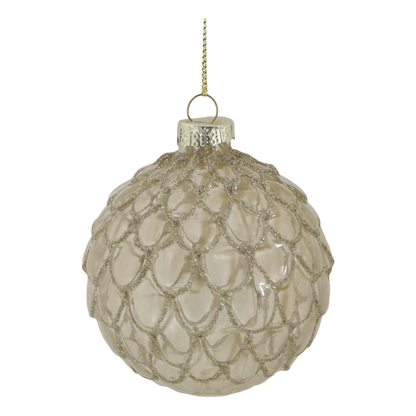 Decorative glass ornament with textured surface on a white background