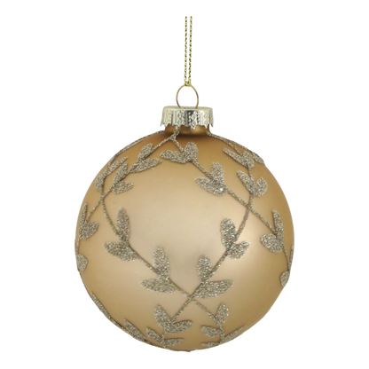 Gold Christmas ornament with silver leaf pattern on a white background