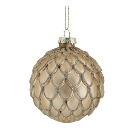 Decorative beige ornament with silver embellishments on a white background