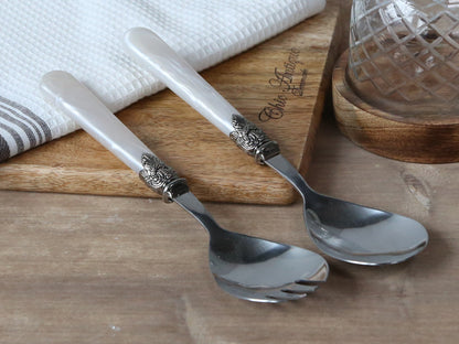 This Salad Server Set of 2 is made with mother of pearl and stainless steel construction, giving it an elegant, chic vintage look. Crafted to last, these servers are easy to wash by hand and will withstand the test of time.