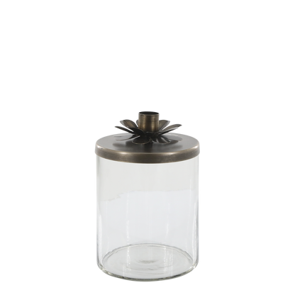 Clear glass jar with a bronze lid on a white background
