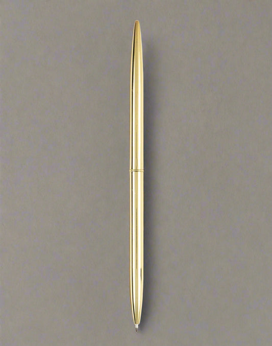 Gold pen on a taupe background