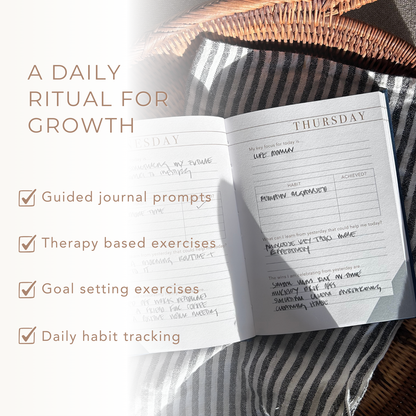 Open journal with daily entries on a striped fabric background, featuring text about a daily ritual for growth.