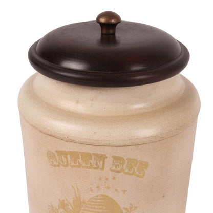 This stylish canister from Dutch Style is perfect for storing items in the home or office. Crafted with a metal body, it has a unique Baroque-style pattern and a wood top. It measures 19x13cm and makes a beautiful statement in any room.  This baroque style iron canister with wooden lid is perfect to use as a storage jar for tea, coffee, sugar or as decoration in any other room of the house. - Generosa