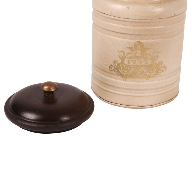 This stylish canister is perfect for storing items in the home or office. Crafted with a metal body, it has a unique Baroque-style pattern and a wood top. It measures 19x13cm and makes a beautiful statement in any room.  This baroque style iron canister with wooden lid is perfect to use as a storage jar for tea, coffee, sugar or as decoration in any other room of the house.  Antique Cream  Dimensions: h.19 x 13 cm. - Generosa