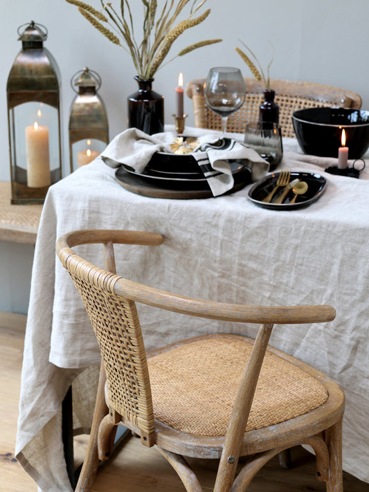 These French style chairs with wicker seat and rounded back are beautiful in a set around the dining table and equally as lovely as a standalone piece.   Dimensions: H79/L50/W45 cm  Material: Rubberwood and rattan Seat height: 46 cm Armrest height : 71 cm   