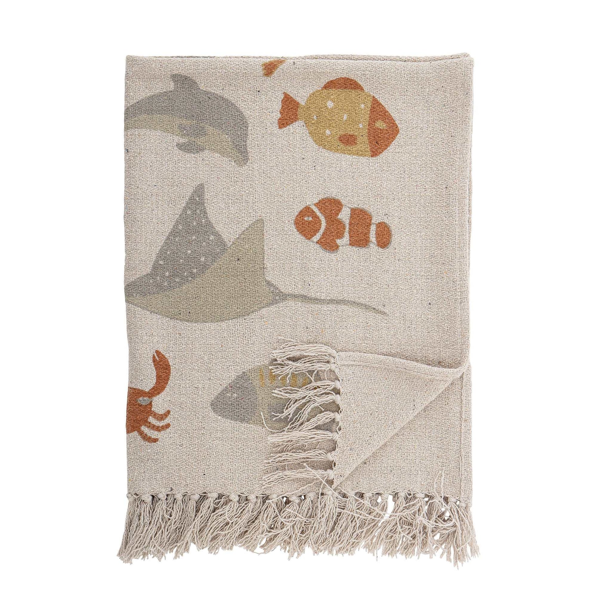 The Abaas Throw by Bloomingville MINI has a beautiful and cute print with different fishes. The throw is made of recycled cotton material and has tassels, which gives a modern look. It is a soft, warm and cozy throw that you easily can use in other rooms than the children's room.  Dimensions: L100cm x H80cm  Material: Recycled Cotton  Machine wash 40 degrees  Tumble Dry Low